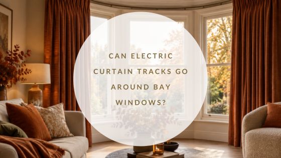 Electric curtain track following a bay window with warm autumnal curtains