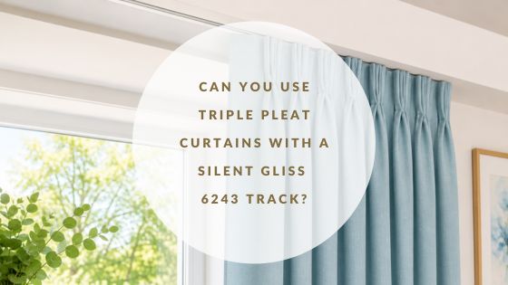 Window with blue triple pleat curtains on a recess curtain track