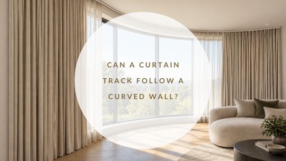 Curved curtain track following a sweeping curved wall with floor-to-ceiling windows and neutral curtains.