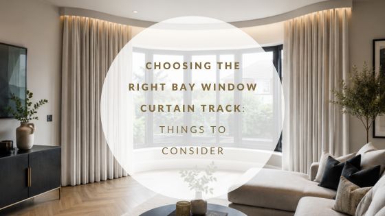 wave shaped bay window - with ceiling mounted curtian track, curtains hanging at the window with lighting lighting up the curtain