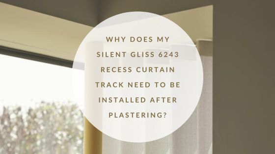 Silent Gliss 6243 recessed curtain track installed within a ceiling recess with wave curtains.